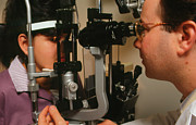 Slit-lamp Examination Of A Young Woman's Eyes Photograph by Science Photo Library