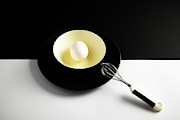 White egg on a yellow bowl. Photograph by Michalakis Ppalis