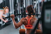 Woman Doing Exercise On A Lat Machine In The Gym Photograph by Science Photo Library