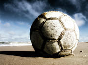 Worn And Old Soccer Ball On Sand Photograph by Vithib
