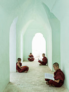 Young Buddhist Monks Reading In Temple Photograph by Martin Puddy