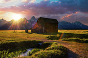Sunset over a historic barn at Mormon Row in Grand Teton National Park, Wyoming #1 Photograph by Miroslav Liska