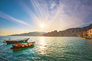 Wooden small boats in Porto Santo Stefano seafront aty sunrise.  #1 Photograph by Stefano Orazzini