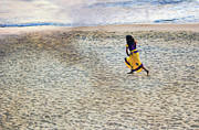 A small girl in a traditional Indian yellow dress runs cheerfully in sandy beach Photograph by Arpan Bhatia A small girl in a traditional Indian yellow dress runs cheerfully in sandy beach Photograph by Arpan Bhatia