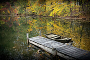 A weathered boat by a wooden dock on a tranquil lake with autumn foliage Photograph by Randall Nyhof A weathered boat by a wooden dock on a tranquil lake with autumn foliage Photograph by Randall Nyhof