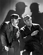 BASIL RATHBONE and NIGEL BRUCE in THE HOUND OF THE BASKERVILLES -1939-, directed by SIDNEY LANFIELD. Photograph by Album