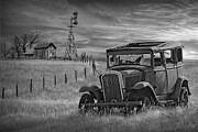 Black and White of abandoned car sits in a grassy field under a cloudy sky Photograph by Randall Nyhof Black and White of abandoned car sits in a grassy field under a cloudy sky Photograph by Randall Nyhof