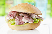Bread roll with pieces of eel, close up Photograph by Westend61