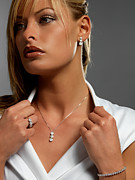 Close-up of girl staring at distance wearing diamond jewelry Photograph by Albertogagna