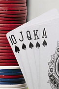 Close-up of the poker of spades with a stack of gambling chips Photograph by Glowimages