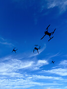 Drones flying Photograph by Sean Gladwell