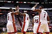 Dwyane Wade, Chris Bosh, and Lebron James Photograph by Mike Ehrmann