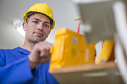 Electrician working with voltmeter Photograph by Westend61