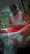 Fisherman repairs the net Photograph by Robert Bociaga