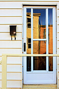 Glass door with golden reflections Photograph by Tatiana Travelways