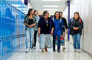 High school kids walking on a corridor alongside their teacher Photograph by Thepalmer