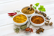 Indian food: ground spices on white table. Photograph by Fcafotodigital