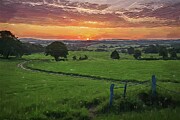 Landscape painting of a serene countryside sunset Digital Art by Vintage Wall Art