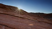 Light behind a rock Photograph by Alberto Audisio