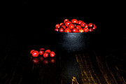 Low Key Cranberries in Black Bowl on Brown Base Photograph by Charles Floyd