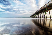 Oceanna Pier With Blue Skies and Dark Clouds Reflected Photograph by Bob Decker