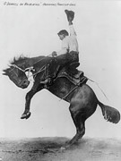 O'Donnell on Whirlwind bucking bronco, Cheyenne Frontier Days Photograph by Vintage Western