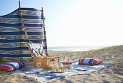 Picnic layed out on beach. Photograph by Dougal Waters