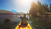 POV of a man kayaking in a calm lake Photograph by Piola666