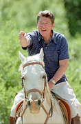 President Ronald Reagan riding his horse Photograph by Mango Art