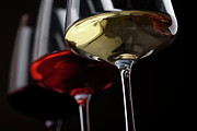 Three Wine glasses with red white and rose wine on black background Photograph by Jelena Jovanovic