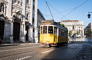 Yellow streetcar in Lisbon, Portugal Photograph by by Marc Guitard