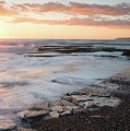 Beautiful dramatic Sunset over a rocky coast Photograph by Michalakis Ppalis Beautiful dramatic Sunset over a rocky coast Photograph by Michalakis Ppalis