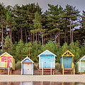 Beach hut row on the Norfolk coast Photograph by Simon Bratt Beach hut row on the Norfolk coast Photograph by Simon Bratt