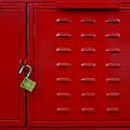 Closeup Of Red Lockers Door And Brass Padlock. by Rita Kapitulski Closeup Of Red Lockers Door And Brass Padlock. by Rita Kapitulski