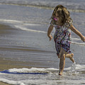 Dancing in the surf with a pink pacifier Photograph by WAZgriffin Digital Dancing in the surf with a pink pacifier Photograph by WAZgriffin Digital