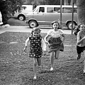 Four Girls Racing, 1972 Photograph by Jeremy Butler Four Girls Racing, 1972 Photograph by Jeremy Butler
