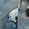 Free In Manhattan - Man Hopping Over A Puddle by Vinayak Garg Free In Manhattan - Man Hopping Over A Puddle by Vinayak Garg