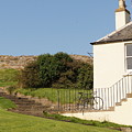 House on the slope with a bike and a lamppost. Photograph by Elena Perelman House on the slope with a bike and a lamppost. Photograph by Elena Perelman