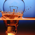 Light Bulb And Splash Water Photograph by Setsiri Silapasuwanchai Light Bulb And Splash Water Photograph by Setsiri Silapasuwanchai