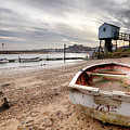 Old rowing boat and lookout tower on beach Photograph by Simon Bratt Old rowing boat and lookout tower on beach Photograph by Simon Bratt