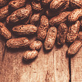 Pile Of Peanuts Covering Top Half Of Board by Jorgo Photography - Wall Art Gallery Pile Of Peanuts Covering Top Half Of Board by Jorgo Photography - Wall Art Gallery