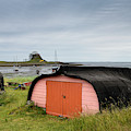 Bright door of shed made of overturned boat cut in half on Holy  by Reimar Gaertner