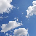 Clouds And Blue Sky by Angie Tirado