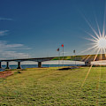 Sunburst at Confederation Bridge Photograph by Marcy Wielfaert Sunburst at Confederation Bridge Photograph by Marcy Wielfaert