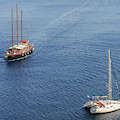 Yachts sailing on a blue calm sea Photograph by Michalakis Ppalis Yachts sailing on a blue calm sea Photograph by Michalakis Ppalis