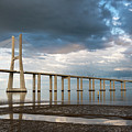 Vasco da Gama Bridge at sunset in Lisbon, Portugal Photograph by Michalakis Ppalis Vasco da Gama Bridge at sunset in Lisbon, Portugal Photograph by Michalakis Ppalis