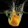 Yellow bell pepper dropped and slashing on water Photograph by Michalakis Ppalis Yellow bell pepper dropped and slashing on water Photograph by Michalakis Ppalis