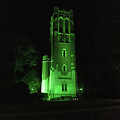 Beaumont Tower at night lit in green on the campus of Michigan State University #43 by Eldon McGraw