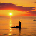 A Ruby Sunrise at Maines Whaleback Lighthouse by Jeff Folger