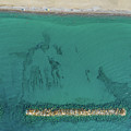 Aerial view from flying drone of people relaxing on the beach. Paphos Cyprus Photograph by Michalakis Ppalis Aerial view from flying drone of people relaxing on the beach. Paphos Cyprus Photograph by Michalakis Ppalis